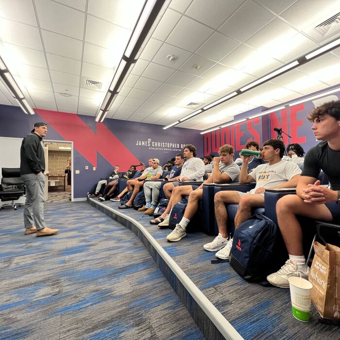 Casey Quinn speaking at Duquesne Athletics